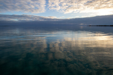 Beautiful calm sea and cloud reflection in the water