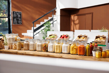 Products sold in bulk at a zero waste store to reduce plastic usage and pollution for a more sustainable lifestyle. Customers who live consciously can purchase eco-friendly pantry staples.