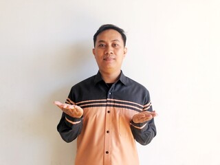 Asian man raises both hands