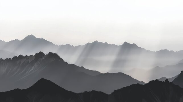 A breathtaking panoramic view of a mountain range at dawn with the first light of day casting a golden glow over the peaks and valleys