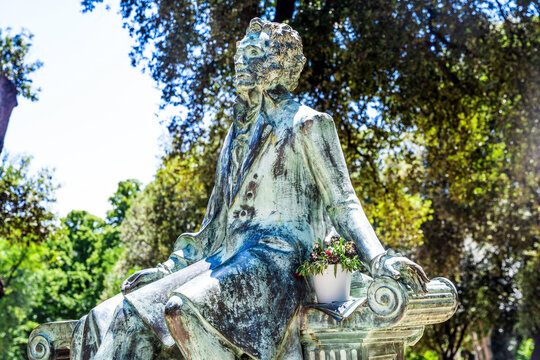 Marble statue of Russian poet Aleksandr Sergeevic Puskin, in the Villa Borghese a landscape garden and public park in Rome, Italy