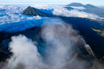 Aerial view Kawah Ijen volcano with turquoise sulfur water lake at sunrise.Amazing nature landscape view at East Java, Indonesia. Natural landscape background