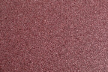 Fototapeta premium Texture of coarse sandpaper as background, top view