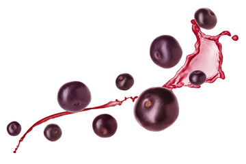 Acai berries and splash of juice in air on white background