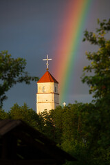 Rainbow and old church