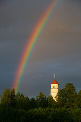 Rainbow and old church