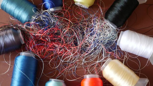 Chaotically tangled threads. Embroidery threads randomly woven. Huge knot. Extreme macro. Beautiful story for intro. Title credits. Abstract screensaver. Handicraft concept, entropy, disorder measure
