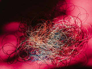 Chaotically tangled threads. Embroidery threads randomly woven. Huge knot. Extreme macro. Beautiful story for intro. Title credits. Abstract screensaver. Handicraft concept, entropy, disorder measure