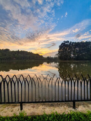 Obraz premium Beautiful sunrise with sky reflection of situ Wanayasa. One of spot tourism destination of Purwakarta West Java Indonesia. 