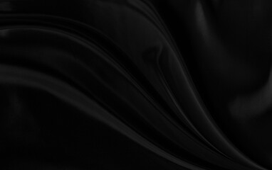Black gray satin dark fabric texture luxurious shiny that is abstract silk cloth background with patterns soft waves blur beautiful.