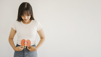 Asian woman holding kidney shaped paper, world kidney day, Organ Donor Day, Chronic kidney disease...