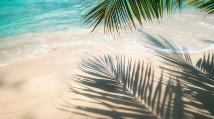Sunny beach scene with golden sand, a palm leaf casting a shadow, and a sparkling turquoise sea Perfect for promoting tropical vacations and relaxation, with ample copy space