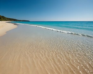 Obraz premium A beautiful beach scene with golden sand, crystal clear blue water, clear sunny sky