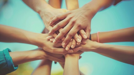 A group of diverse people joining their hands together. AIG535