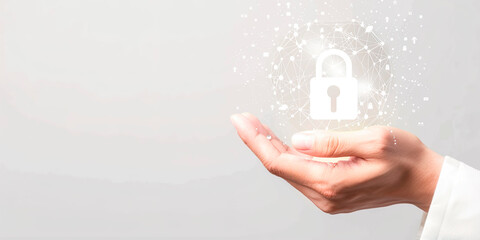 A hand holding a padlock in front of a white background. Concept of security and protection