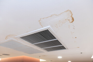 Air conditioner has water drop leak on air grille and mold on ceiling stain and cracked.