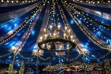 blue ribbons waves with circle rainbow chandelier made by red yellow green ribbons. ribbon decoration on ceiling at beer festival. typical decoration at a oktoberfest. ribbons as ceiling decoration