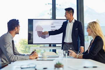Office, presentation and business man with statistics for financial profit, infographics or growth charts. Diversity, colleagues and person by television for marketing data, budget review or meeting © NonVig/peopleimages.com