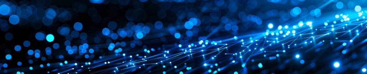 Abstract image of blue neon lights with bokeh effect, perfect for backgrounds and technology-themed designs.