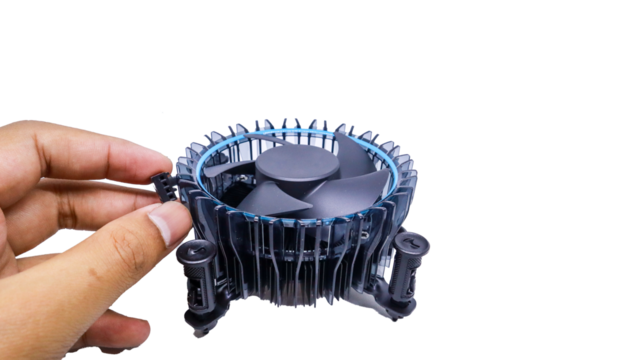 A close up of a man's hand touching a CPU cooler fan is isolated on white backgrounds. The fan is black with blue accents and has a circular design with blades for efficient cooling.