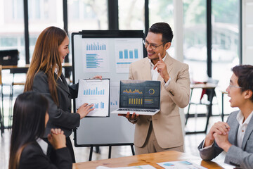 Professional diverse business team presenting and discussing data charts and graphs during meeting in modern office.