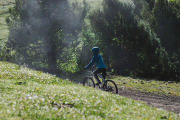 Naklejka premium Riding mountain bike in the beautiful mountains