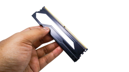A man's hand holding a RAM stick, a vital component for computer performance speed RAM modules feature black heatsinks with gold connectors isolated on a white background.