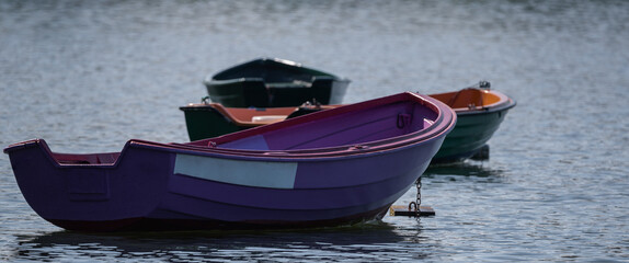 LANDSCAPE BY THE LAKE - Small old rowing boats on the lake