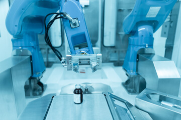 Chemotherapy drug compounding robot with syringe and medicine bottle.Hihg technology pharmaceutical production vaccine concept.New innovation.