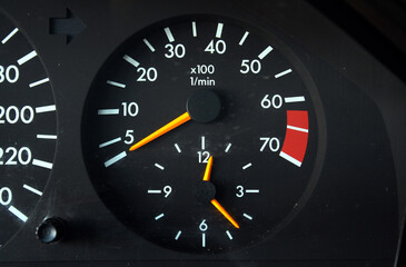 Tachometer old car. Tachometer of an old car with high mileage. Dashboard of an old school car. Crankshaft rotation speed arrow.