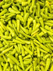 Natural pattern of fresh organic green peppers. A full of many peppers vegetable background.