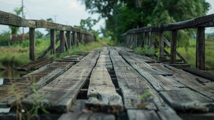 Obraz premium An Old Wooden Bridge At Sangkhla Buri, Thailand, With Weathered Planks And A Rustic Charm