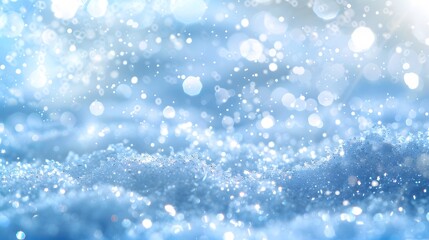 Obraz premium Light snow bokeh background on shiny glitter light blue snow winter for Christmas festive background. 