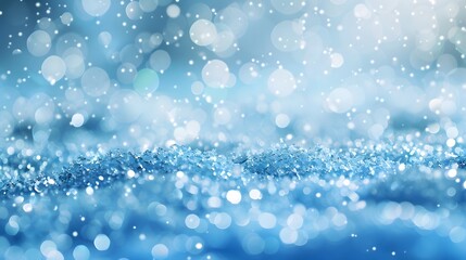Light snow bokeh background on shiny glitter light blue snow winter for Christmas festive background. 