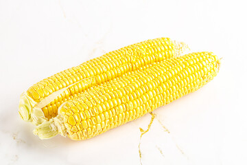 Sweet yellow raw corn cob