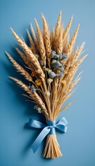Dried flowers and wheat stalks bundled together with a ribbon, on an light blue background, vertical, smartphone format, stories, stories format, social format, social, socials, 3:2, 9:16