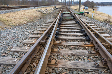 Fototapeta premium Beautiful railroad tracks in Riga, Latvia. Overcast spring day.