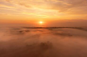 A beautiful misty morning aerophotography of rural landscape in Latvia. Natural summer scenery in...