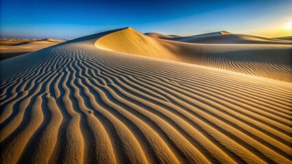 Naklejka premium Sweeping sand dunes with intricate wind-blown patterns, isolated on a clean, minimalist background, devoid of people or copyrighted elements.