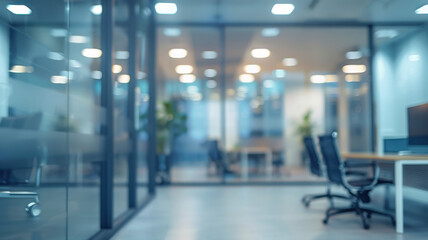 Modern office space: a bright corridor with glass partitions and minimalist design. Bright lighting and a plant create a professional atmosphere. The blurriness of the image emphasizes the dynamics.