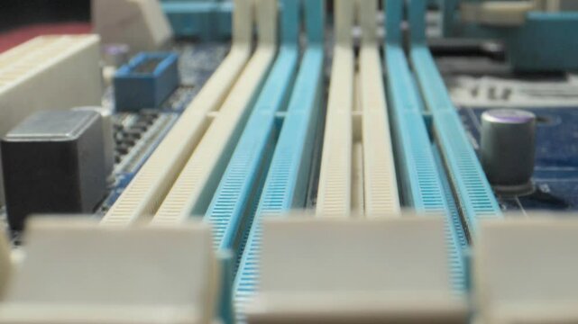 pc motherboard dirty ram module slots closeup view
