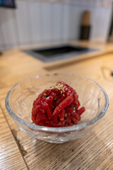 Yukhoe, a raw beef meat sliced and seasoned with salt, sugar, sesame oil, pepper, and garlic, etc. It is famous Korean food.