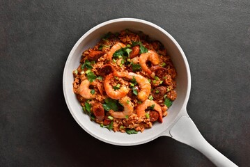 Creole jambalaya with prawn, smoked sausages and vegetables in c