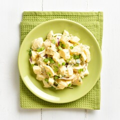 Potato salad with egg, pickle, green onion with mayonnaise and y