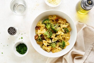 Farfalle pasta with roasted broccoli and mushrooms in bowl