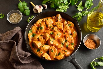 Chicken tikka masala curry in cast iron pan