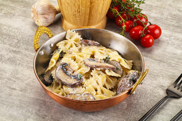 Italian cuisine - farfalle with mushrooms