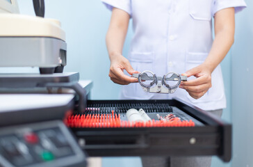 Opthalmology woman hands holding prisms lens or tools eyesight.