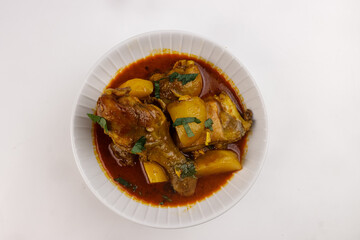 Murgir Jhol or Bengali Chicken Curry is Spicy, delecious and Soupy Chicken Curry With Potatoes.