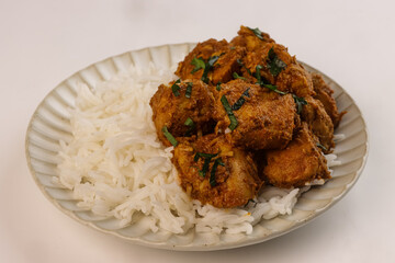 Chicken Bhuna Curry is a Spicy and Flavorful Dish from Indian Cuisine, Served with Rice. 